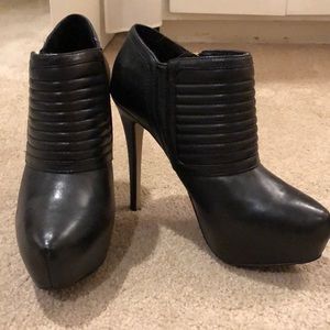 Heeled black booties
